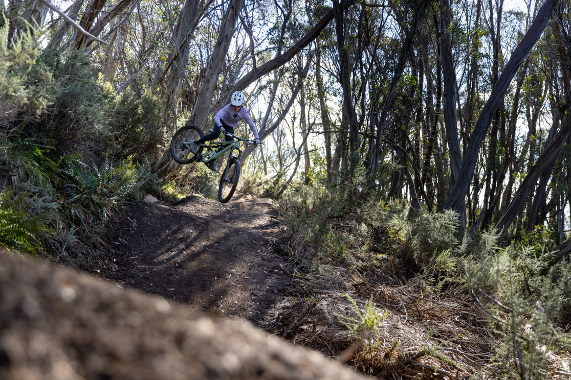 Thredbo Ambassador Maddie Lloyd riding Thredbo Resort’s new jumps trail through alpine bushland
